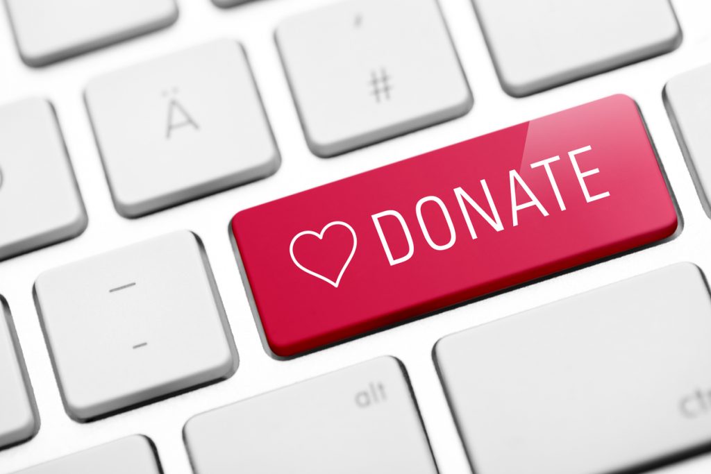 online donate key on keyboard to encourage recycling old electronics for reuse