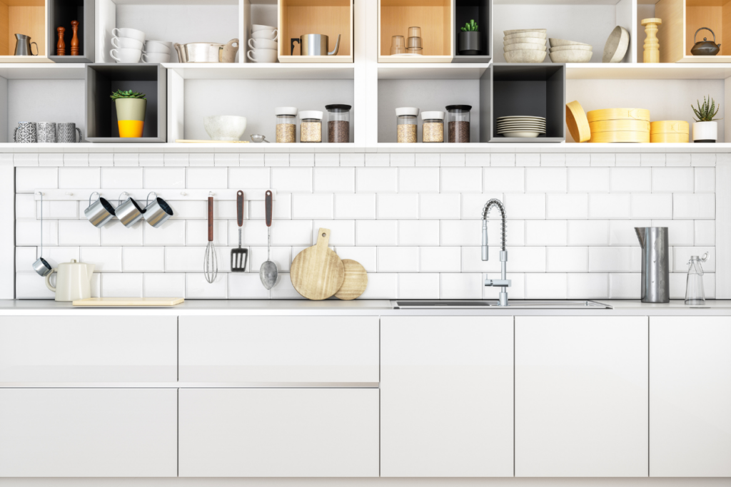 cabinets and shelves in a kitchen. includes sink, dishes, and trinkets on the counters and shelves