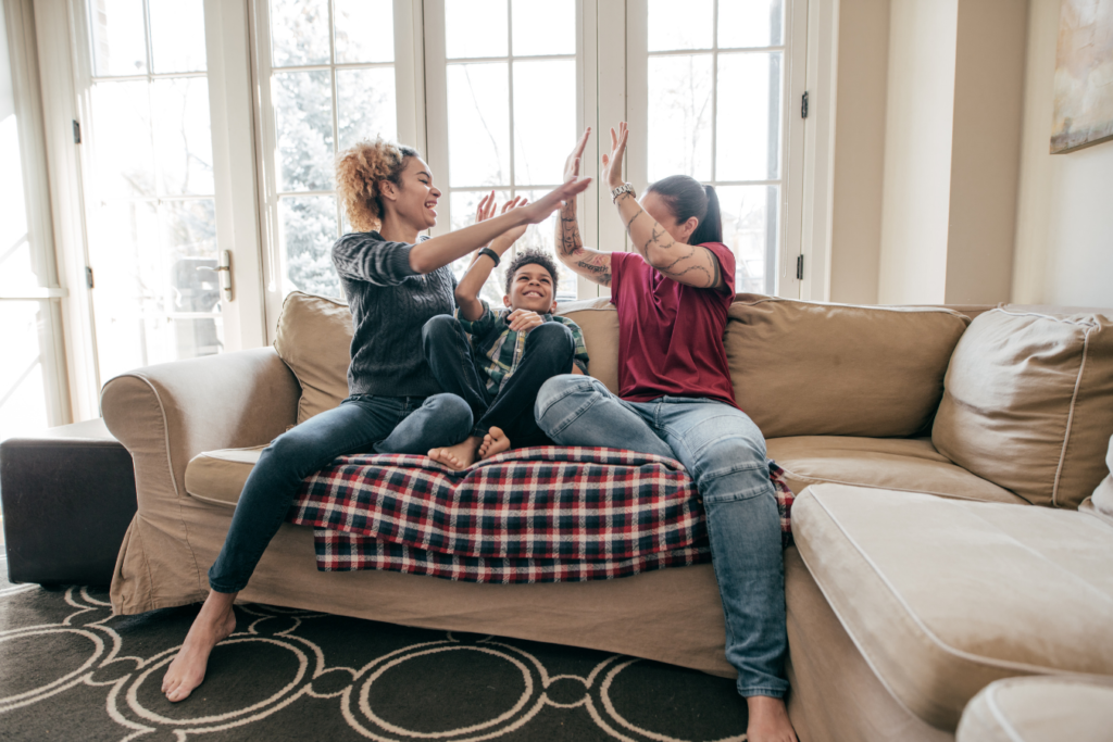 Family high fiving to celebrate