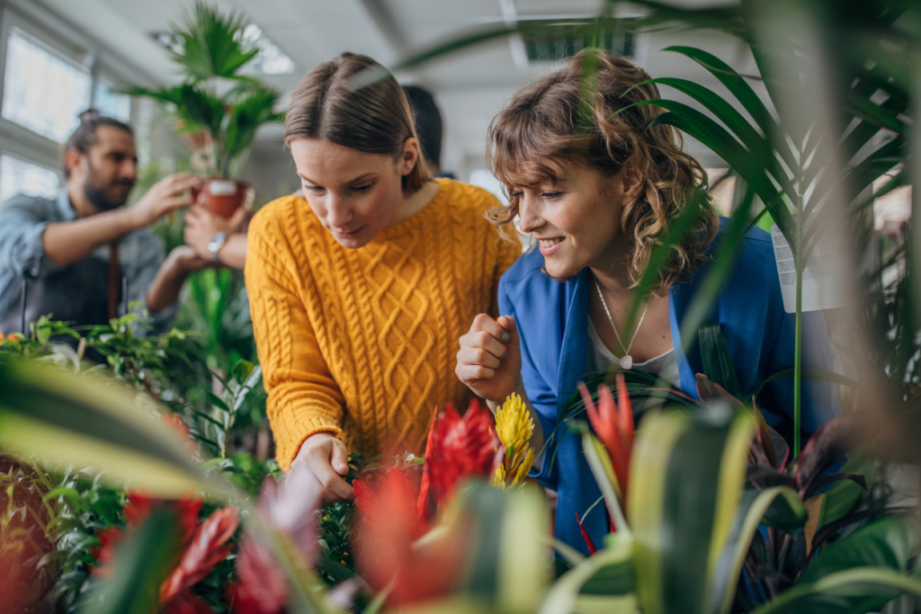 two women shopping for plants at a garden store