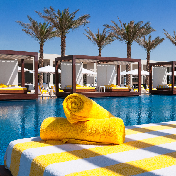 Beach resort with yellow towels by the pool